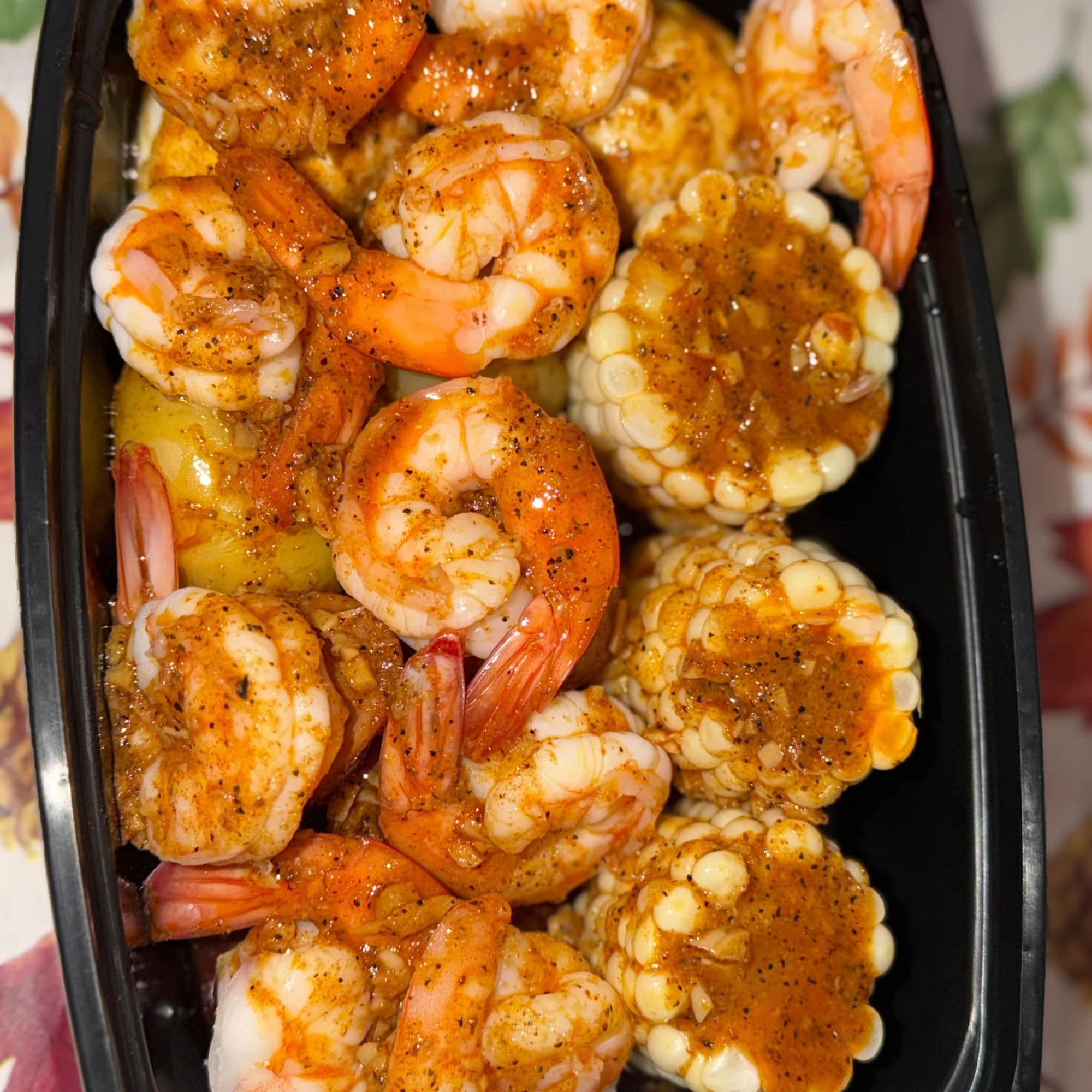 Seasoned shrimp and corn close-up