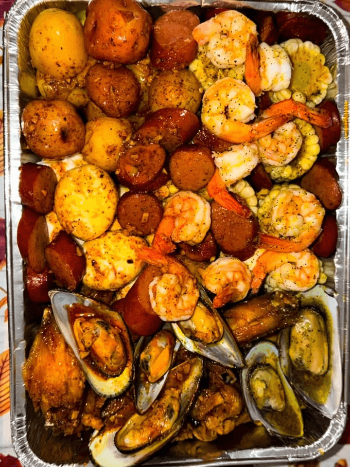Shrimp, sausage, corn, potatoes, eggs, and mussels boil